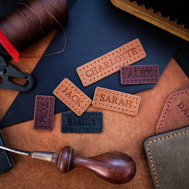 Beautiful small handmade leather label featuring neatly embossed personalisation