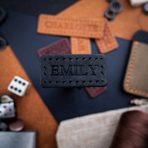 Beautiful small handmade leather label featuring neatly embossed personalisation