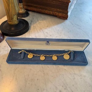 Magnificent Vintage BIRKS 18K (750) Yellow Gold CHARMS Bracelet (circa 1970-1990)