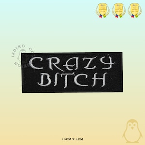 May include: Black embroidered iron-on patch with white text that reads "CRAZY BITCH". The patch is 10 cm by 4 cm.