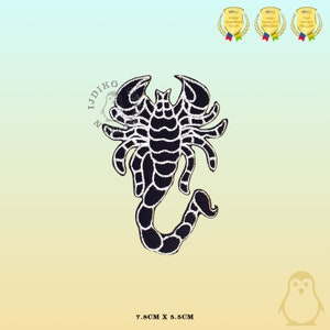 May include: Black scorpion embroidered patch with white outline. The patch is 7.8 cm by 5.5 cm.