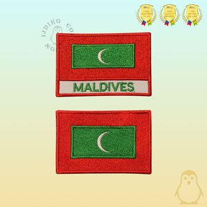 May include: Two embroidered patches featuring the flag of the Maldives. The top patch has the flag with the word "MALDIVES" below it. The bottom patch is just the flag.