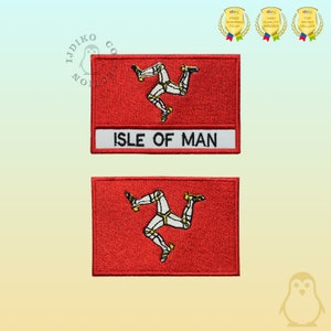 May include: Two red rectangular patches featuring the Isle of Man flag. Each patch has a white banner with "ISLE OF MAN" in black text. The flag design includes three armored legs with yellow spurs.