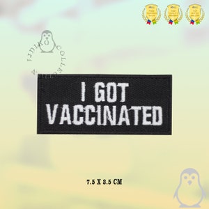 Peut inclure: Patch brodée noire avec du texte blanc qui dit "I GOT VACCINATED". Le patch mesure 7,5 cm sur 3,5 cm.