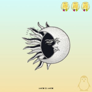 May include: A white and black embroidered patch of a sun and moon with a face. The sun has a black face and the moon has a white face. The patch is 10 cm by 10 cm.