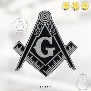 May include: Black and white embroidered patch featuring a square and compass with a 'G' in the center. The patch is 8.5 inches by 8.5 inches.