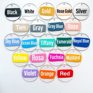 May include: A set of 20 round acrylic tags with different colored paint stripes and white text naming the colors. The colors include black, white, gold, rose gold, silver, tan, gray, gray blue, rose, sky blue, ocean blue, tiffany, emerald, royal blue, yellow, rosa, fuchsia, mustard, violet, orange, and red.