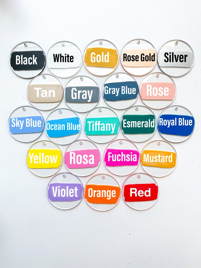 May include: A set of 20 round acrylic tags with different colored paint stripes and white text naming the colors. The colors include black, white, gold, rose gold, silver, tan, gray, gray blue, rose, sky blue, ocean blue, tiffany, emerald, royal blue, yellow, rosa, fuchsia, mustard, violet, orange, and red.