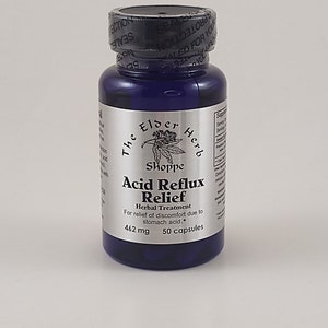 May include: A dark blue bottle of "Acid Reflux Relief" herbal treatment capsules. The label includes the text "The Elder Herb Shoppe" and details about the product, including 462 mg and 50 capsules.