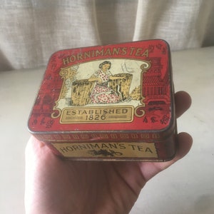Tin of Horniman’s Tea. Vintage Red tin box decorated with oriental themes. Memorabilia Tea Box Container.