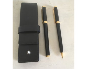 Juego de bolígrafo y portaminas Montblanc Noblesse Oblige, en estuche de piel Montblanc original. Bolígrafos en tono dorado y negro.