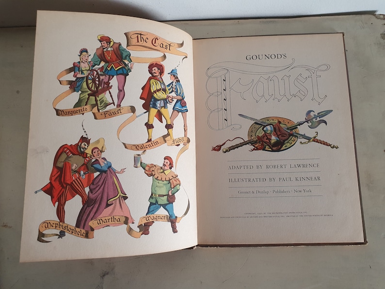 May include: An illustrated book cover for a children's adaptation of Gounod's opera Faust. The cover features a colorful cast of characters from the opera, including Faust, Marguerite, Mephistopheles, and Valentine. The title "Gounod's Faust" is written in a large, decorative font.