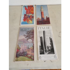 May include: Four vintage travel brochures featuring Italian destinations. The brochures showcase colorful illustrations of the Adriatic coast, Tuscany, Italian lakes, and Italian cityscapes. Each brochure has text in English, Italian, and French.