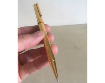 Yves Saint Laurent balpen. Vintage goudkleurige luxe en verzamelbare pen. Draaimechanisme Rollerball vergulde pen.