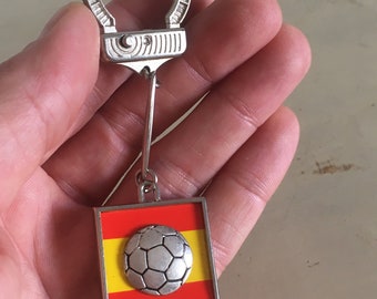 PORTE-CLÉS FOOTBALL MONDIAL ESPAGNE 82. ORANGE no2