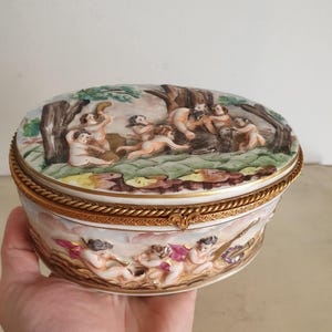Antique Hallmarked Capodimonte Porcelain Oval Jewelry Box with Cherub Relief, Hand-Painted with Gold Accents, 19th Century Italian Art.