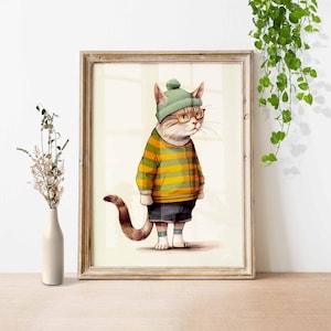 May include: A framed illustration of a cat wearing a green and yellow striped sweater, a green beanie, and round glasses. The cat is standing on a white background.