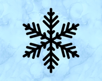 May include: Black snowflake design on a light blue background. The snowflake is a symmetrical six-pointed star shape, with each point featuring multiple branches. The background has a watercolor-like effect.