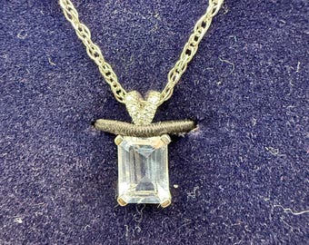 sterling silver pendant necklace featuring a light blue rectangular gemstone