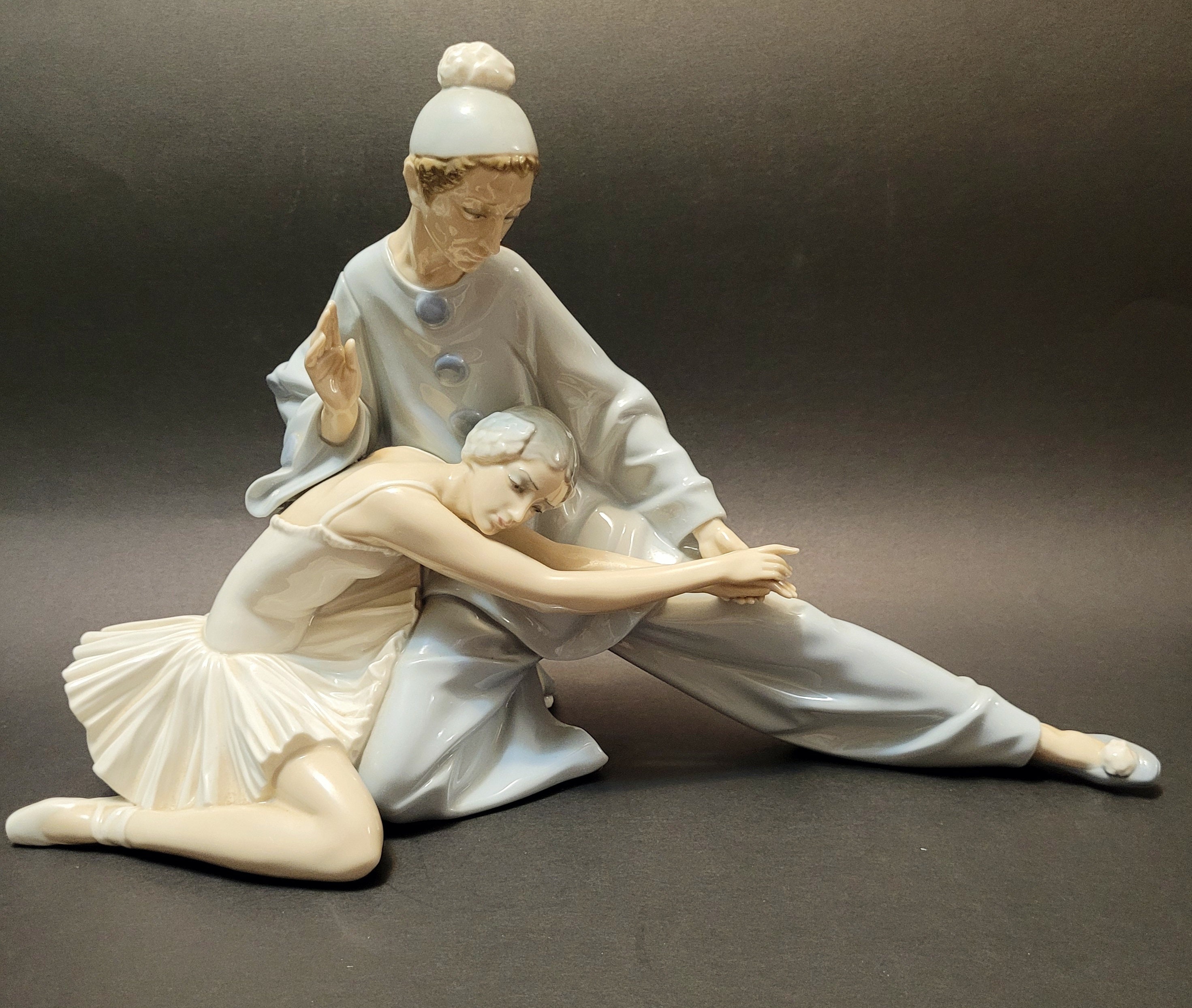 Four Lladro porcelain figure groups, comprising Closing Scene, No. 4935,  Once Upon A Time, No. 5721