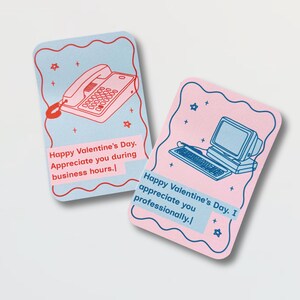 May include: Two Valentine's Day cards with retro illustrations. One card features a red telephone on a light blue background with the text "Happy Valentine's Day. Appreciate you during business hours." The other card has a computer on a pink background with the text "Happy Valentine's Day. I appreciate you professionally."