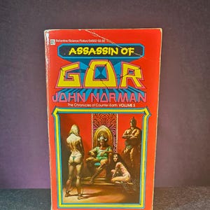 May include: A set of three ceramic mugs with a speckled, matte finish. The mugs are in shades of cream, light gray, and dark gray. Each mug has a simple, modern design and a rounded handle.