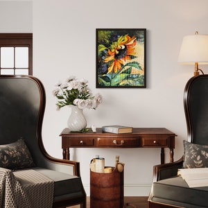 以下が含まれることがあります： オレンジと黄色の花びら、緑の葉、濃い茶色の背景を持つひまわりを描いた額縁付きの絵画。絵画はリビングルームの白い壁に飾られています。