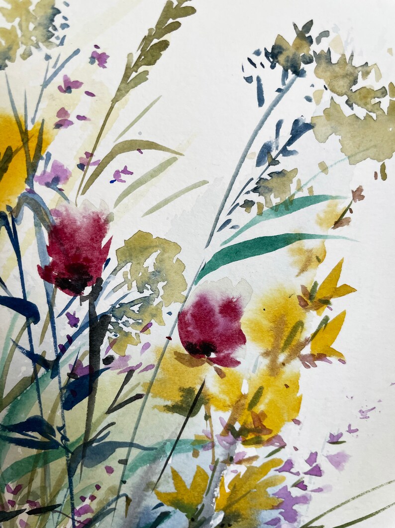 May include: A watercolor painting on textured paper featuring a botanical arrangement of wildflowers. The composition includes deep magenta blossoms, vibrant yellow clusters, and various green stems and grasses rendered in loose, fluid brushstrokes.