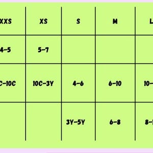 May include: A size chart with a light green background and black grid lines. The chart lists sizes for children, women's, and men's clothing, with corresponding numerical size ranges for each category. The text is in black.