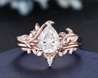 Anillo de compromiso Moissanite inspirado en la naturaleza conjunto 14K oro rosa 1.25ct pera Moissanite diamante anillo de boda hoja vid rama bypass conjunto nupcial