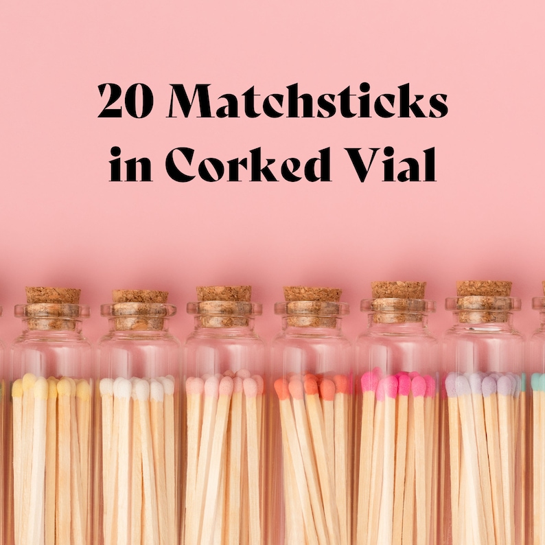 May include: Eight glass vials with cork stoppers, each filled with 20 colorful matchsticks. The vials are arranged in a row on a pink background. The text "20 Matchsticks in Corked Vial" is displayed above the vials.