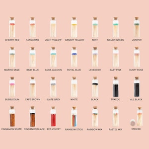 May include: Assortment of small glass jars filled with colorful matchsticks. Each jar has a cork lid and a label with a different color name and a corresponding color of matchsticks. The colors include cherry red, tangerine, light yellow, canary yellow, mint, melon green, juniper, marine sage, baby blue, aqua lagoon, royal blue, lavender, baby pink, dusty rose, bubblegum, cafe brown, slate grey, white, black, tuxedo, all black, cinnamon white, cinnamon black, red velvet, rainbow stick, rainbow mix, pastel mix, and striker.