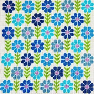 May include: A repeating pattern of blue, green, and pink flowers on a white background. The flowers are stylized and have a simple design.