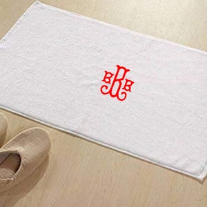 May include: White rectangular bath towel with a red monogram in the center. The towel is made of a soft, absorbent material. The monogram features the letters B, R, and B in a decorative script.