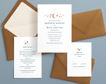 May include: A wedding invitation suite with a celestial theme. The invitation features a crescent moon and stars in a light blue color with gold accents. The text reads "Together with their families, Phoenix Hadley and Maia Jupitus request the pleasure of your company at their wedding, Saturday 15th July, 2023, The Royal Observatory, Blackheath Avenue, London, SE10 8XJ. Dinner, dancing & merriment to follow."