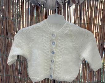 White hand knitted sweater for baby