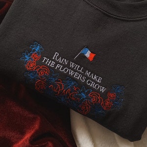 Rain Will Make the Flowers Grow Les Misérables Unisex Embroidered Sweatshirt