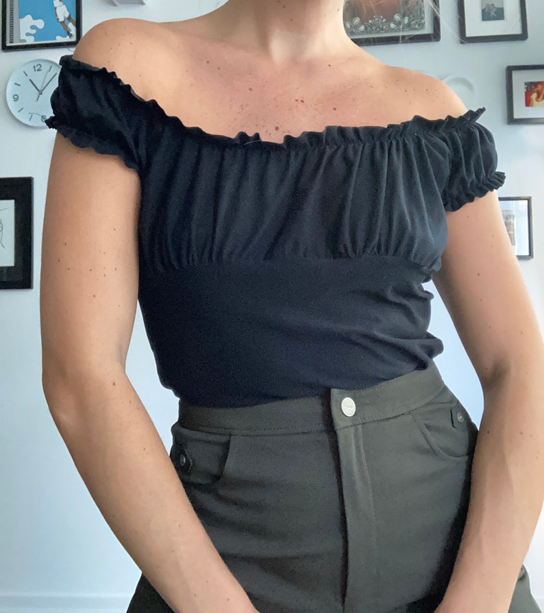 Black ruffled short sleeve off the shoulder tshirt