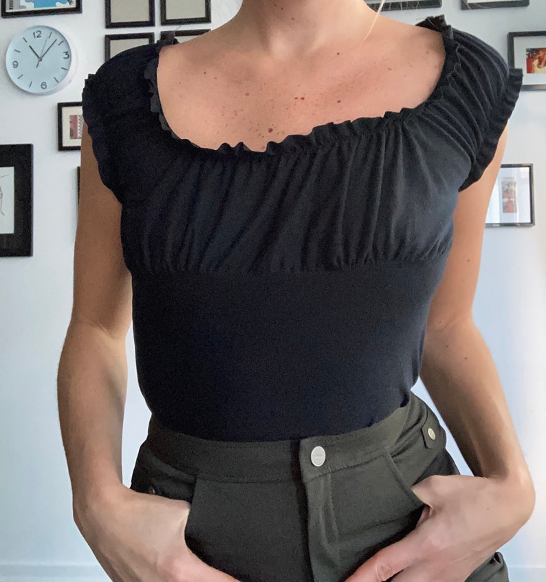 Black ruffled short sleeve off the shoulder tshirt