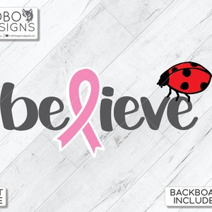 May include: A pink ribbon with the word "believe" in gray text and a red ladybug on the right side of the word. The background is a white woodgrain pattern.