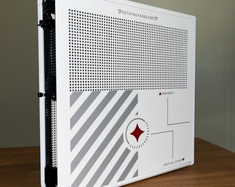 May include: White gaming console with a black and gray striped design and a red diamond in the center. The console has a perforated front panel with the text "ROTATING FAN BLADES" and "VERTICAL STAND" printed on it.