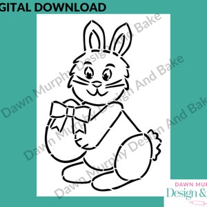 May include: Black and white line art illustration of a bunny holding an Easter egg with a bow. The bunny is sitting down with its ears up and its tail behind it.
