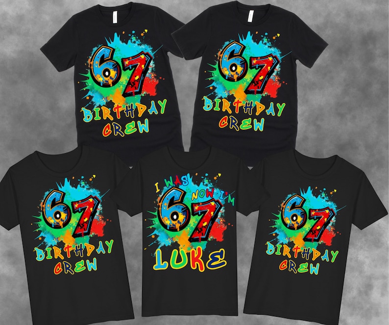May include: Black t-shirts with a colorful graphic design. The design features the number "67" in blue and red, surrounded by a splash of paint and the words "BIRTHDAY CREW". One shirt says "I WAS NOW I'M 67 LUKE".