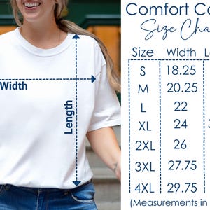 May include: A white t-shirt with a size chart. The chart lists measurements in inches for sizes S through 4XL. The text "Comfort Colors" and "Size Chart" are at the top.