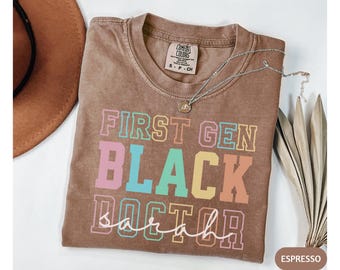 Personalized Comfort ColorsFirst Gen Black Doctor Shirt, Black PhD Grad Shirt, Doctorate Graduation Gift, Grad Shirt for Her, PhD Tee
