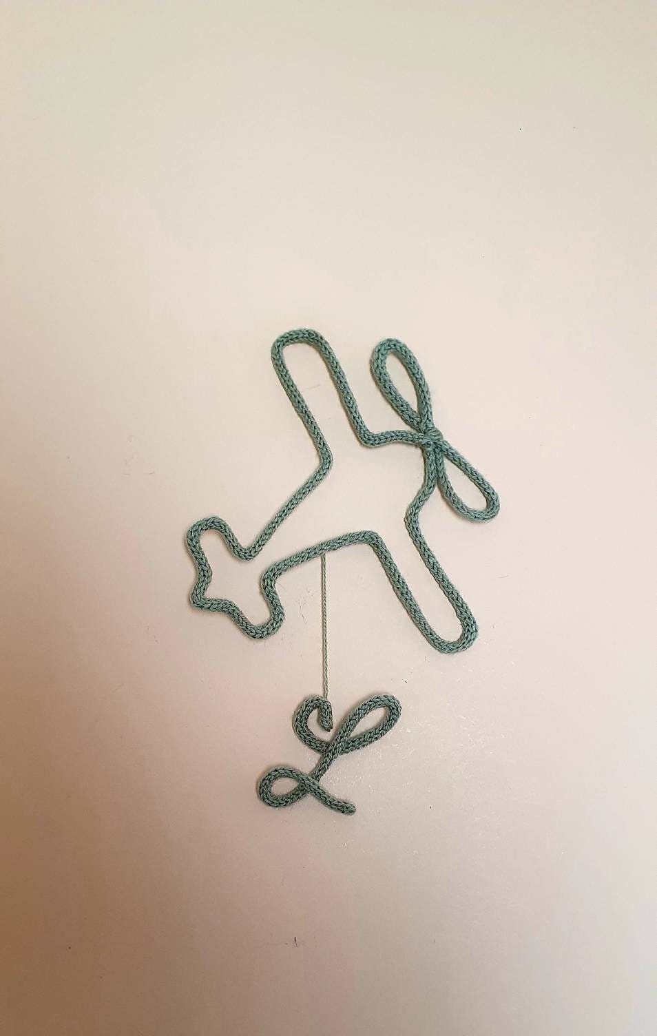 Avion avec Initial en Tricotin