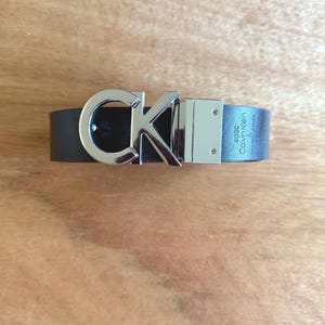 Calvin Klein Monogram Plaque Reversible Belt Black Silver NWOT
