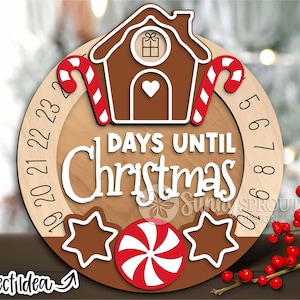 May include: A wooden Christmas countdown ornament featuring a gingerbread house design, candy canes, and a peppermint swirl. The numbers 19 to 23 and 5 to 10 are visible on the ornament. The text "DAYS UNTIL CHRISTMAS" is printed on the ornament.
