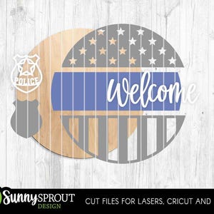 May include: Wooden round sign with a police badge cutout and a design featuring a blue stripe, stars, and the word "Welcome" in white script. The sign is made of natural wood and has a rustic aesthetic.