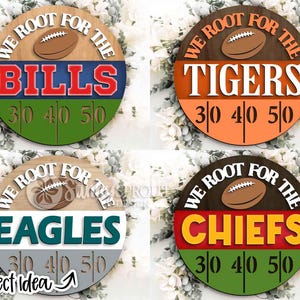May include: Four circular wooden signs featuring a football graphic at the top, the text WE ROOT FOR THE, a team name in large block letters, and a football field yard line design at the bottom with the numbers 30, 40, and 50 displayed.